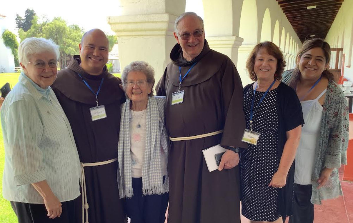 Br. Ed McKenize, OFM, poses with some of the people who have assisted with the Coming Home retreats. Pictured from left are Sr.  Mary Joseph Picone, SM, Provincial Councilor Br. Roger Lopez, OFM, Sr. Josephine Bryan, SP, Br. Ed, Gwyn Grimes, executive director of Mission San Luis Rey, and Sandra Dominguez, who is in charge of all hosted retreats. (Photo courtesy of Old Mission San Luis Rey) 