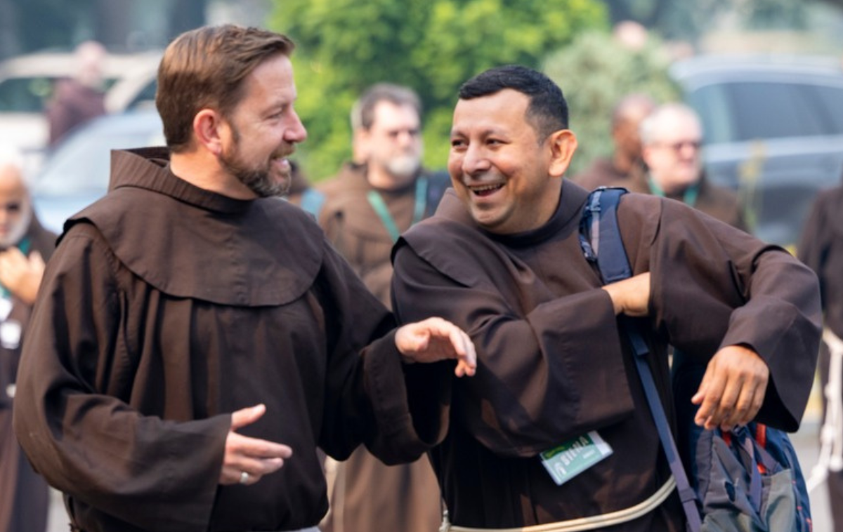 Brothers John Aherne, OFM (left), and Juan de la Cruz Turcios, OFM, share a moment at Siena University in 2023. Friars often discover that God's plans for them lead them to places and experiences they never thought imaginable. (Photo by Br. Octavio Duran, OFM)