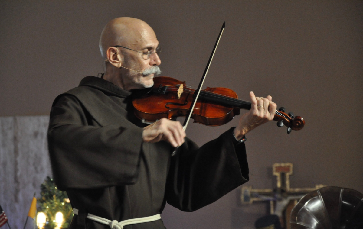 A friar plays the violin