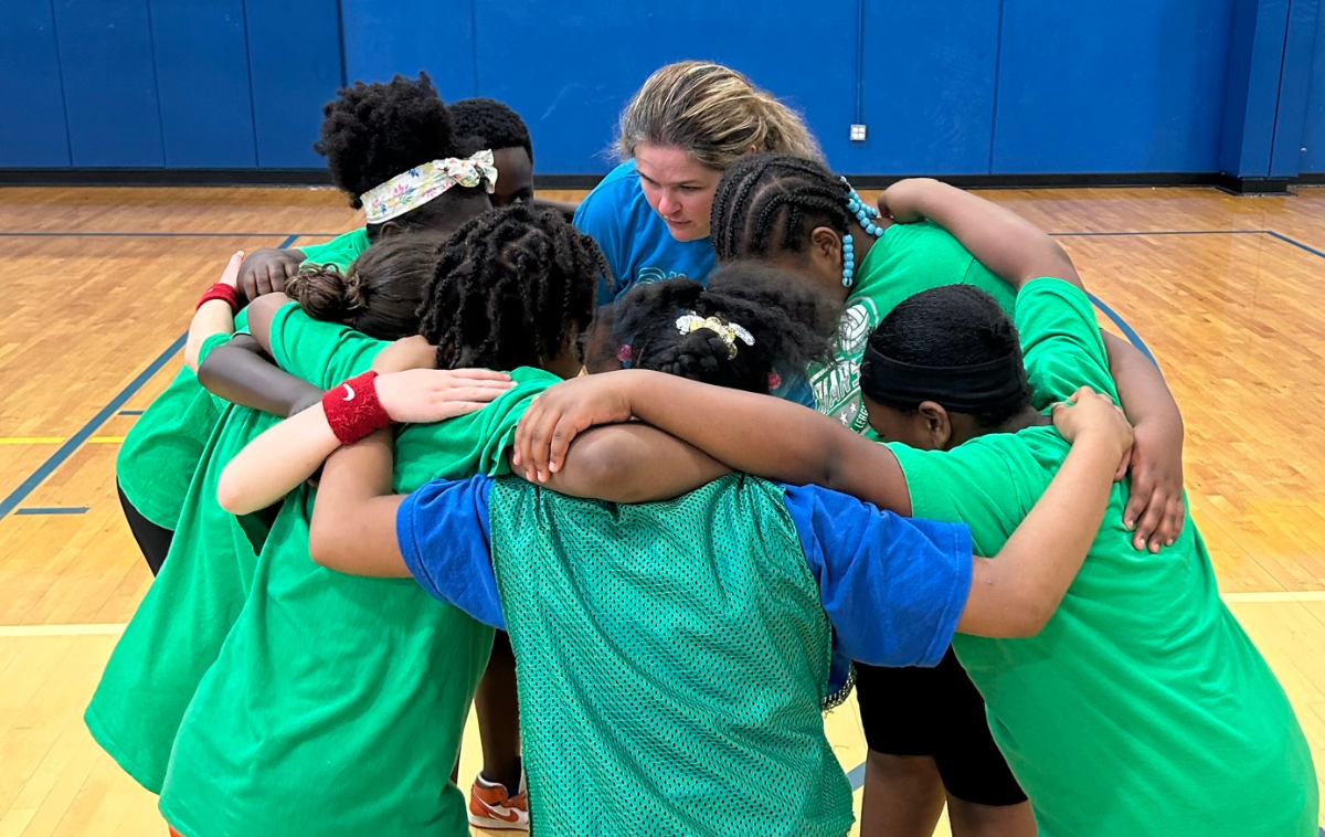 A team huddles up at the Friars Club court. Basketball is just one offering for youth enrichment in this Franciscan program. (Photo courtesy of Friars Club Cincinnati)