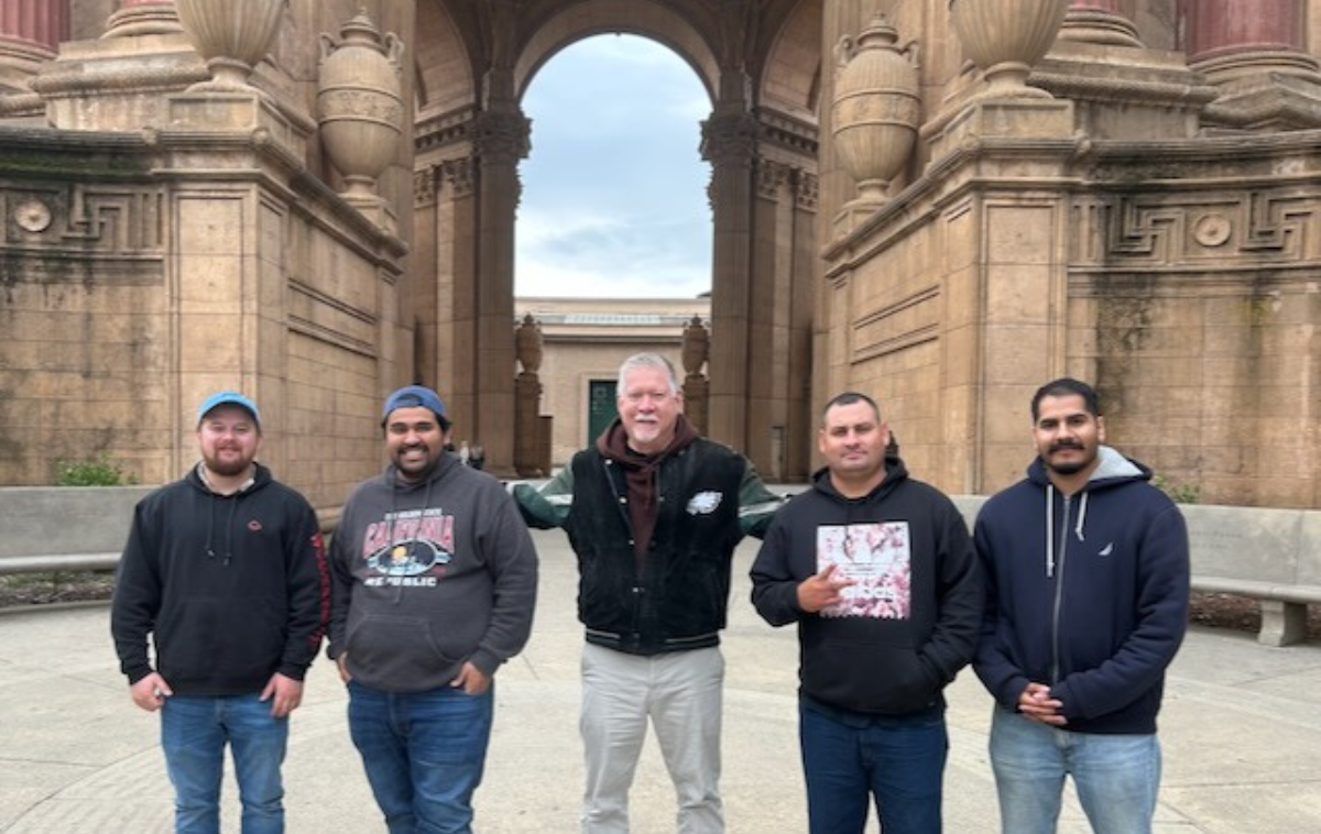 Br. Tony Luevano, OFM, second from left, and Br. Greg Plata, OFM, center, with the discerners in front of the Palace of Fine Arts. (Photo courtesy of Greg)