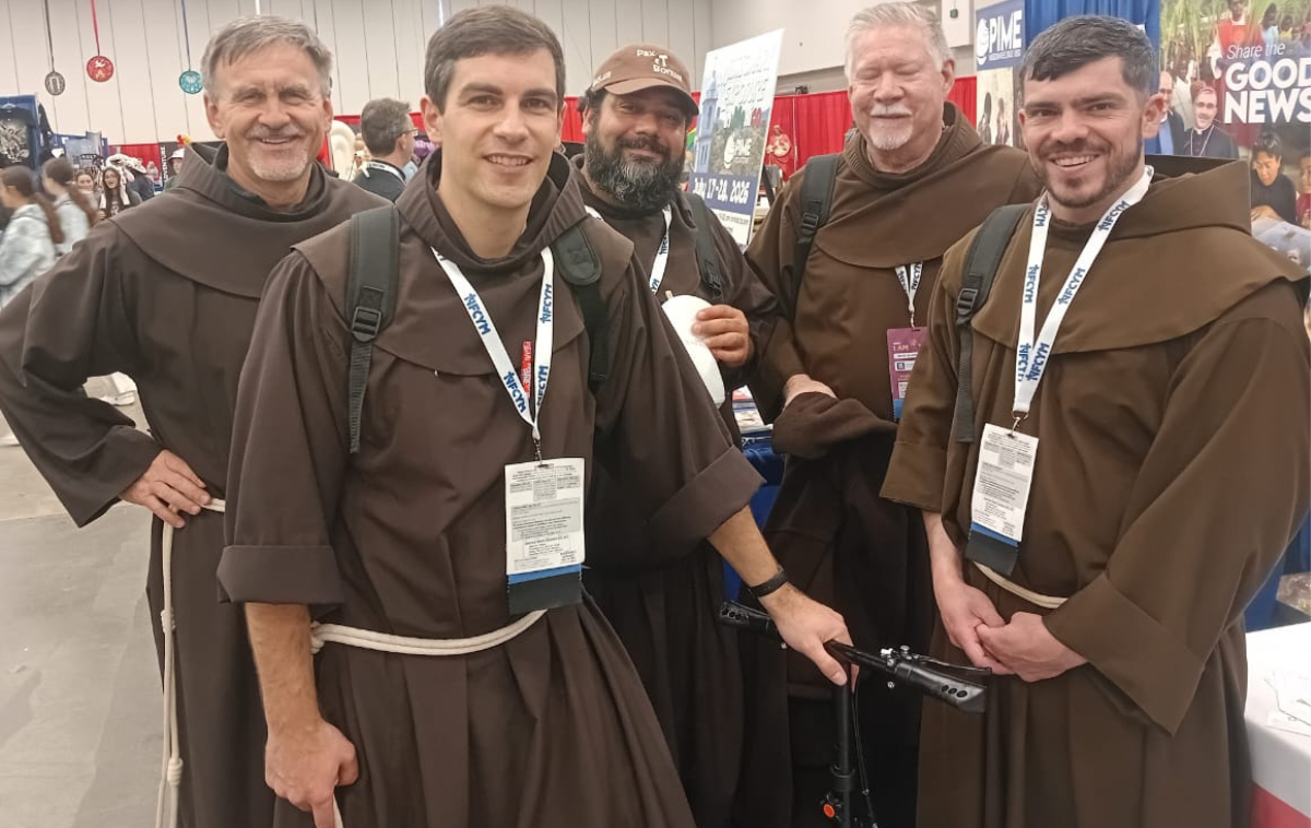 Brothers Jacek Orzechowski, OFM, Casey Cole, OFM, Tito Serrano, OFM, Greg Plata, OFM, and Jason Damon, OFM, received many guests at their interactive booths at NCYC, where attendees and friars gained new insights. (Photo courtesy of Br. Jacek)