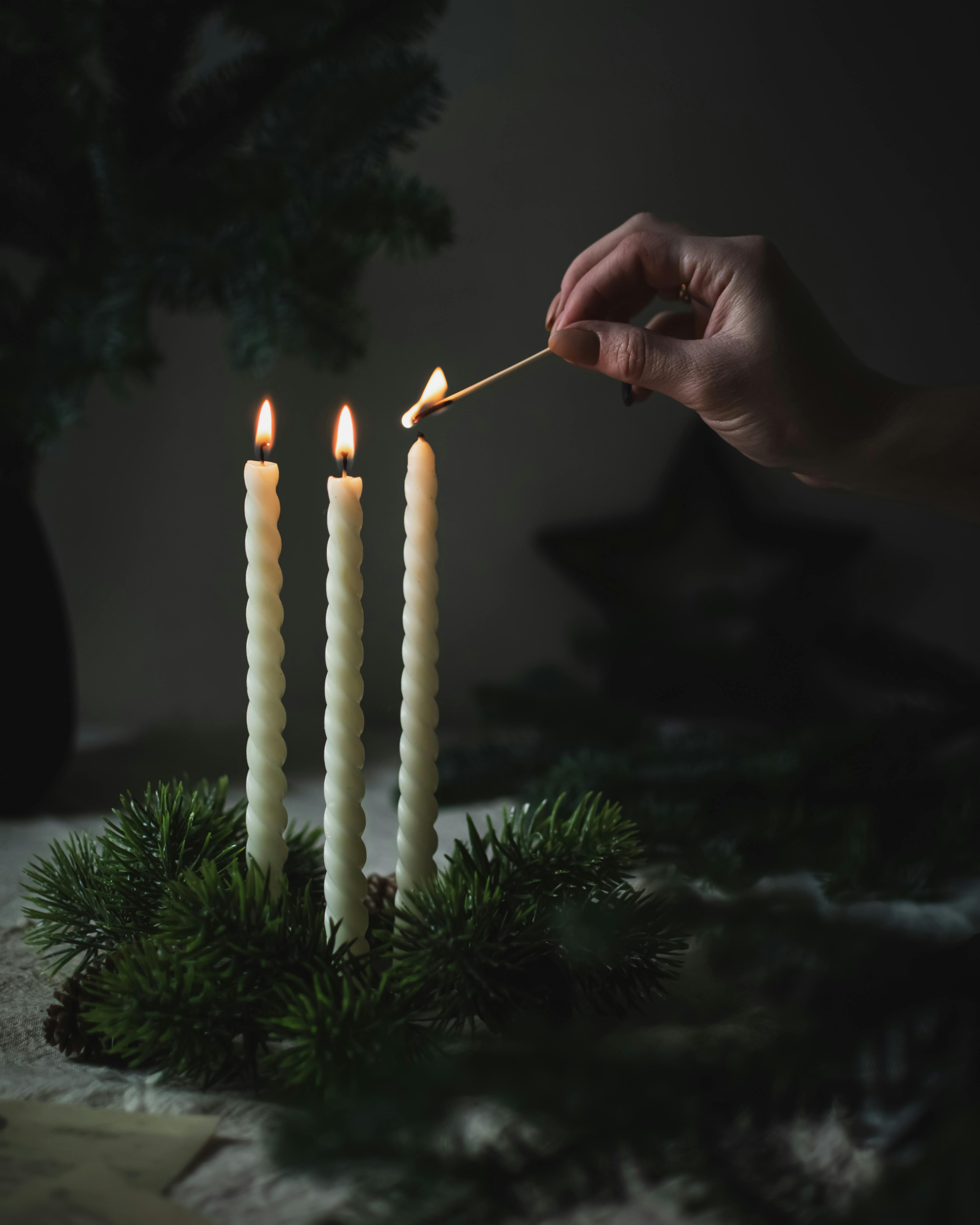 Photo by Юлия Чалова: https://www.pexels.com/photo/hand-lighting-candle-10668083/