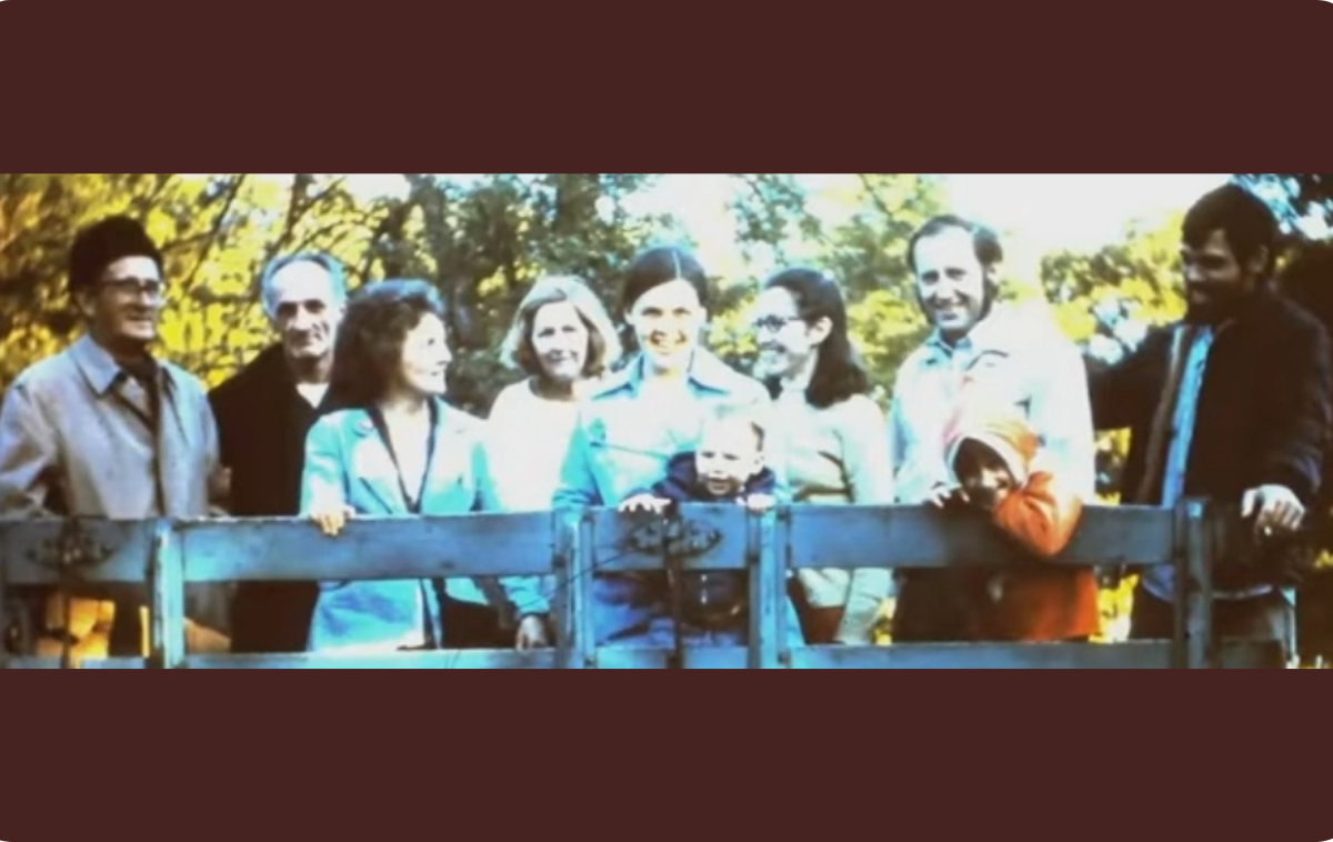 Members of the Gospel Family community pose for a photo in the back of a trailer on the grounds of a Catholic retreat house run by Franciscan sisters. The group grew crops and sold them in town. In a Zoom call with several group members, one member recalled that they accidentally planted cherry tomatoes instead of classic globe tomatoes. (Photo courtesy of Br. David) 