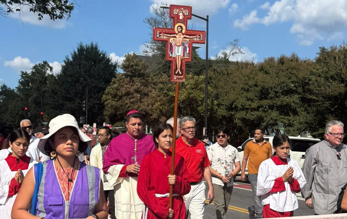 Catholics from the Archdiocese of Washington, D.C., including friars and members of the St. Camillus faith community, participate in a procession for World Day of Migrants and Refugees. (Photo Courtesy of St. Camilus Parish)