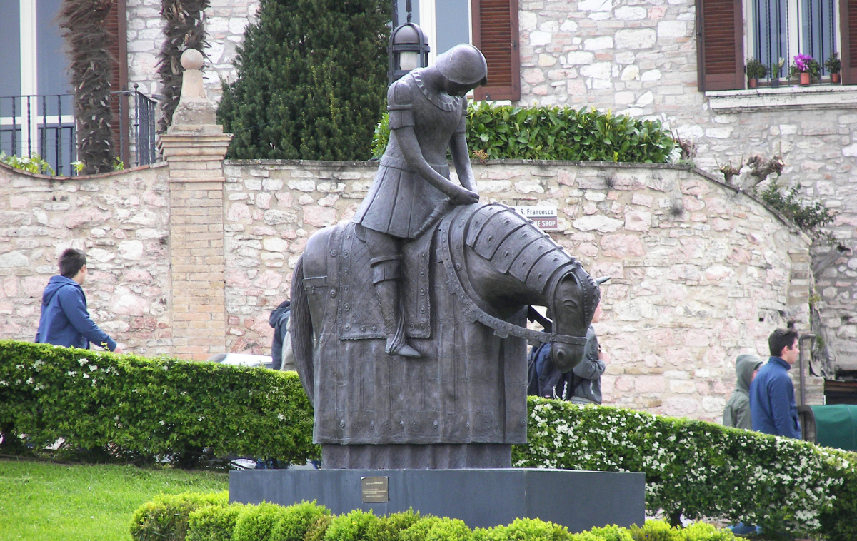 &ldquo;The Return of Francis," is a modern sculpture created by Italian artist Norberto Proietti in 2005. Located in Assisi, it depicts a young St. Francis as a dejected, failed soldier.