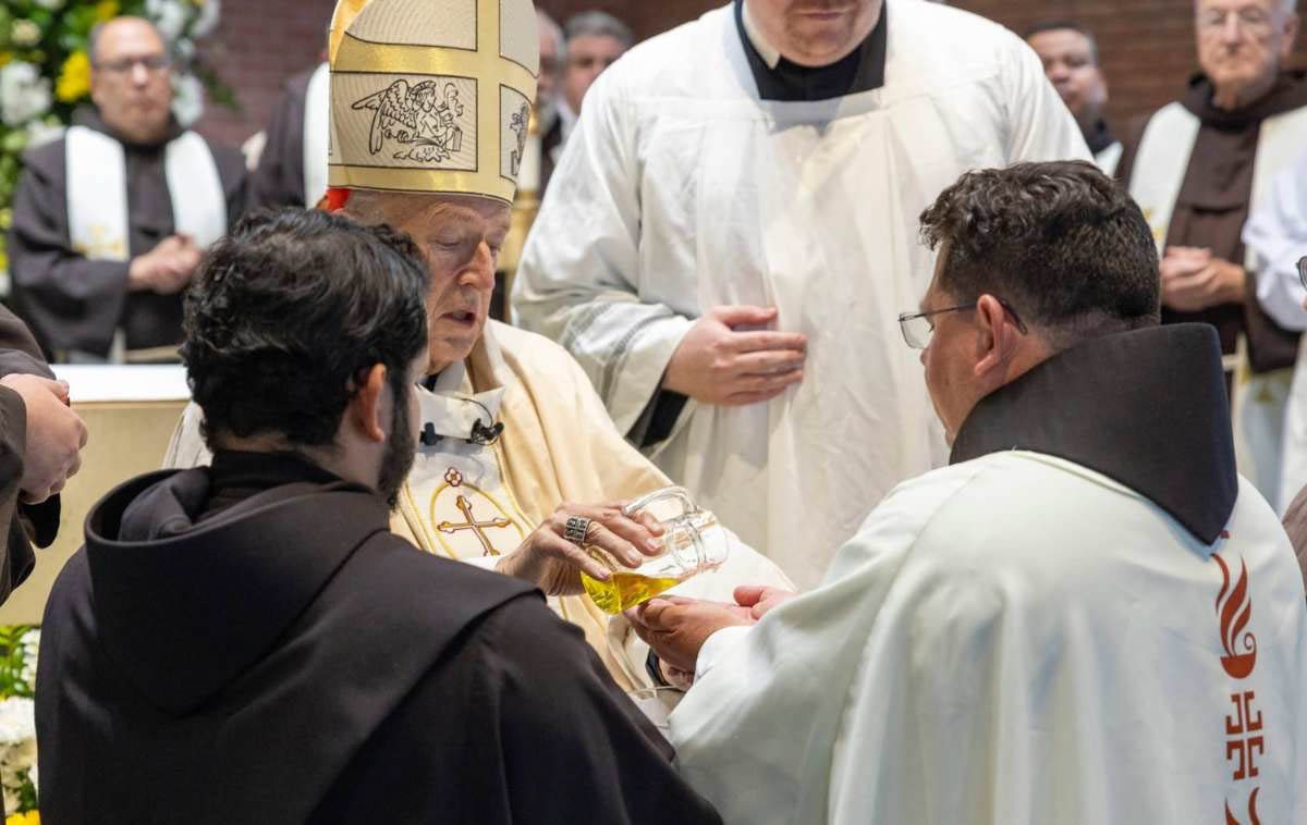 Cardinal McElroy anoints Br. Maikel's hands with sacred chrism so that like Jesus, he may be a servant to the people of God, carrying out His works through the work of his hands. (Photo courtesy of Br. Octavio Duran, OFM)