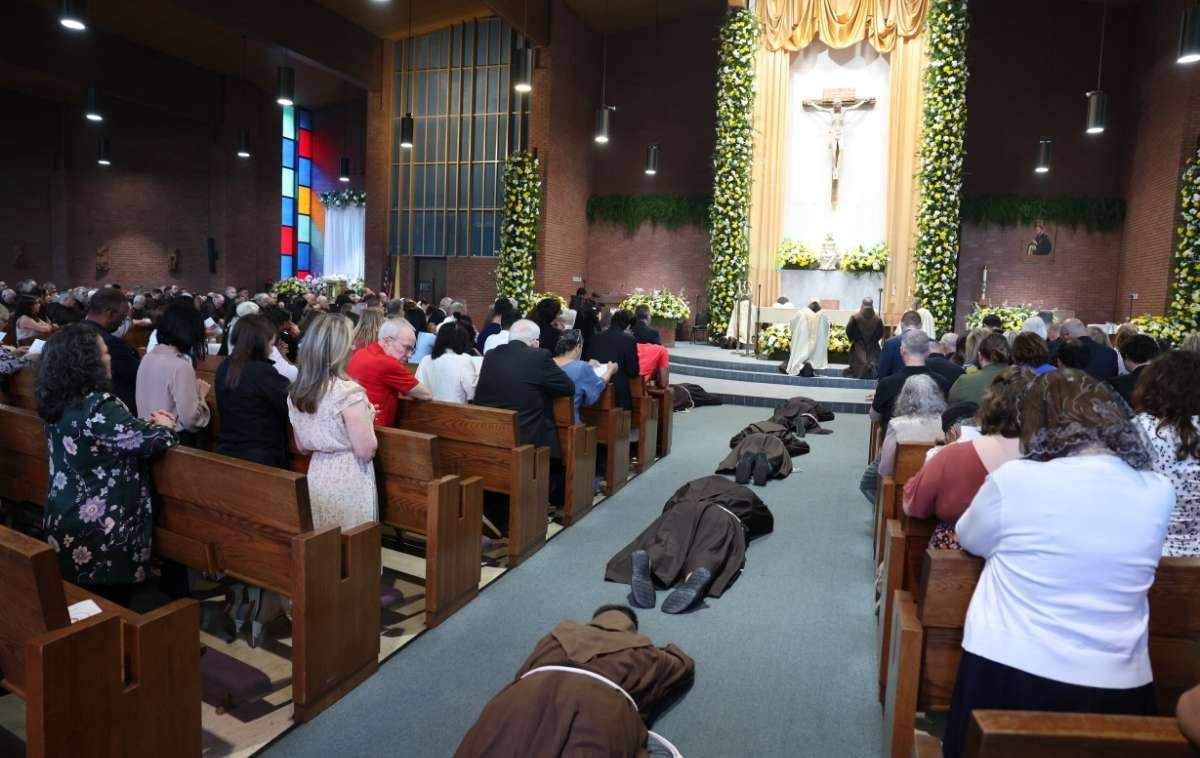 The candidates lie prostrate before the altar as the assembly prays the Litany of the Saints, asking for their intercession as the friars prepare to profess their final vows. (Photo courtesy of Br. Octavio Duran, OFM)