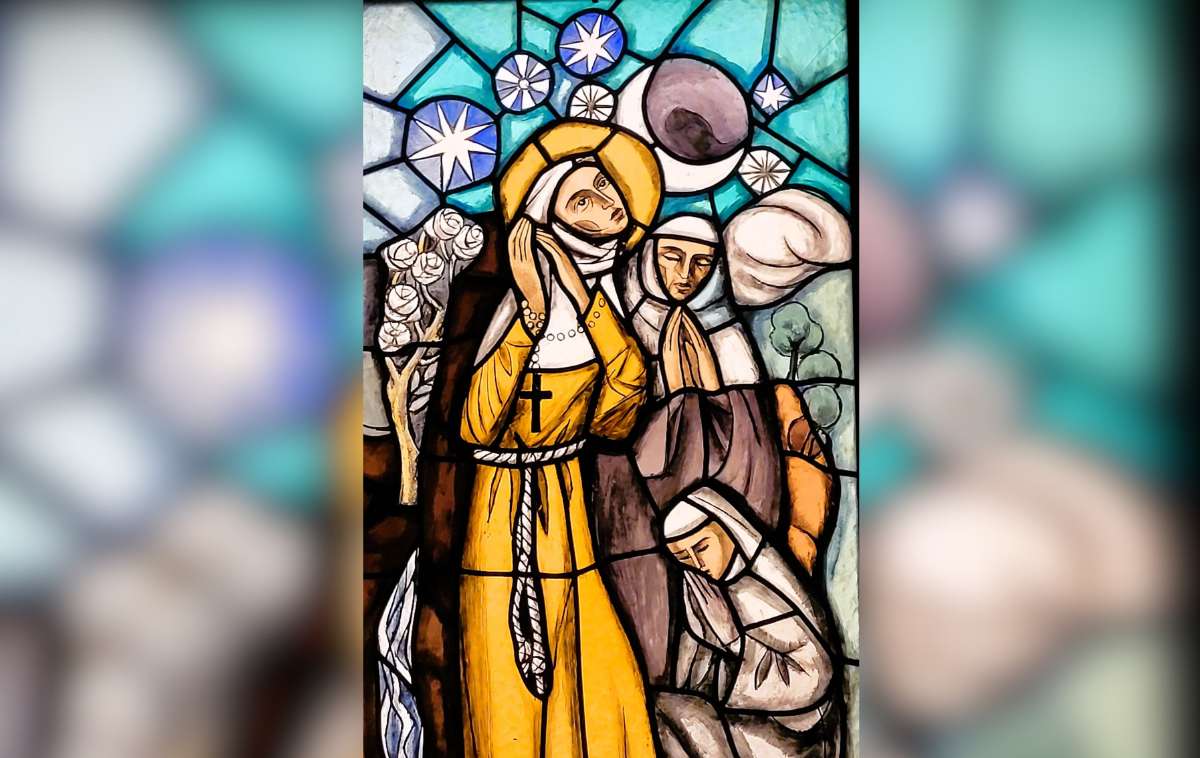 St. Clare and her sisters depicted praying beneath a starry night in stained glass that hangs in the Church of San Damiano in Assisi. (Photo courtesy of Br. Gilberto Cavazos-Gonzalez, OFM)