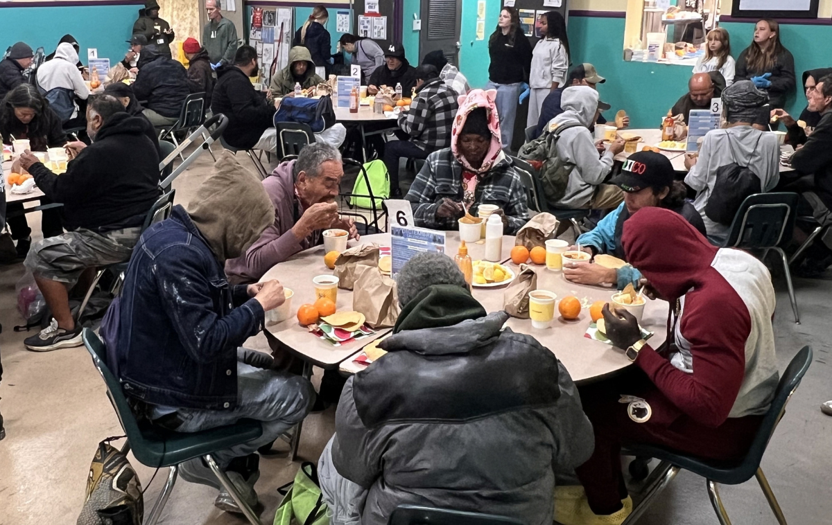Guests gather for a meal at St. Francis Center. In the past year, with help 
from 2,100 volunteers, the Center served more than 168,000 meals, 
provided nearly 2,600 showers and washed about 3,000 loads of laundry. (Photo courtesy of St. Francis Center)