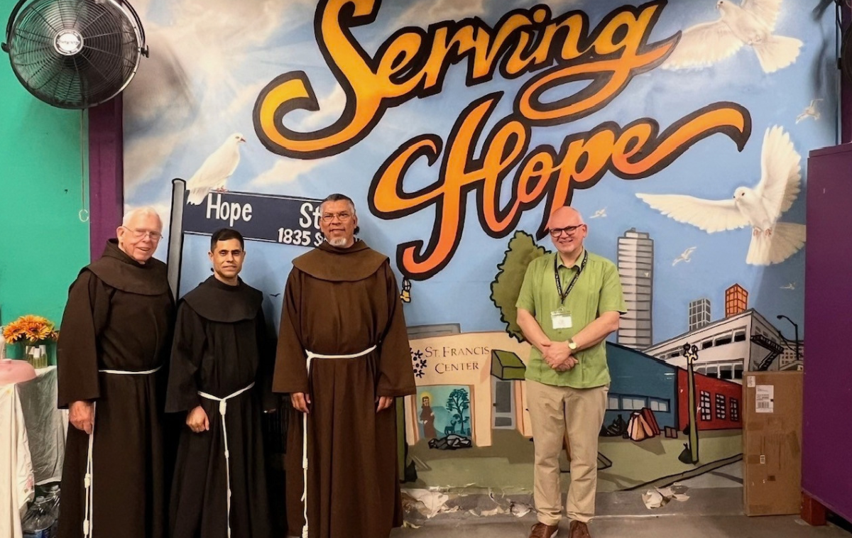 <div><p paraid="2018742837" paraeid="{f66f4dec-d519-472a-8b06-85c366ca48d1}{217}">Brothers
 Ignatius Harding, OFM, Victor Vega, OFM, and Raul Diaz, OFM, stand with
 St. Francis Center Executive Director Damian Kabot before a mural at 
the Center. &ldquo;We try to see each person with respect,&rdquo; Br. Victor says, 
&ldquo;to listen to their stories and remind them that they are important, 
that they belong.&rdquo; (Photo courtesy of St. Francis Center) &nbsp;</p></div>