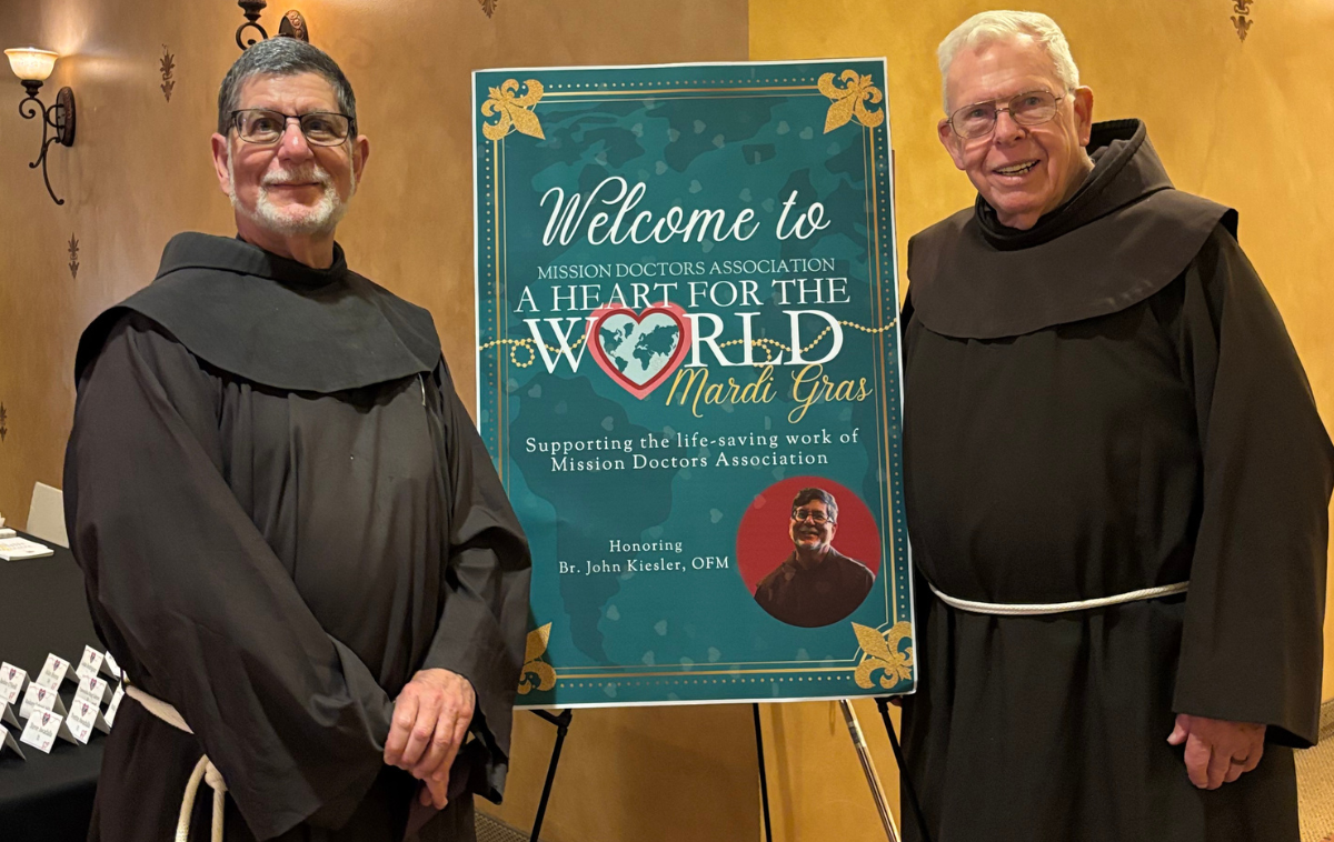 Br. John Kiesler, OFM, left, with
 Br. Ignatius Harding, OFM, at the awards ceremony. Doctors and 
missionaries worldwide sent videos recognizing Br. John