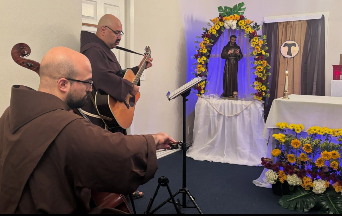 Brothers Juan Luis Guerrero, OFM, on guitar, and Br. Tyler Grudi, OFM, on cello, provided the musical accompaniment to the feast day activities. (Photo courtesy of Duns Scotus Friary)