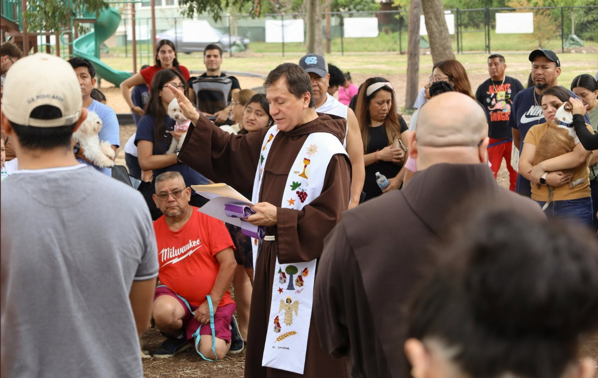Br. Gonzalo de Jesús Torres-Acosta, OFM, gives a blessing to the people and creatures assembled for the blessing of the animals. (Photo courtesy of Immaculate Conception Church)