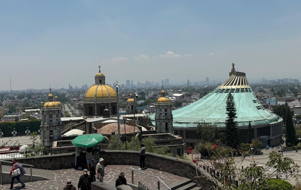 The Old Basilica, left, and New Basilica of Our Lady of Guadalupe are seen from Tepeyac Hill in Mexico City during an earlier Franciscan pilgrimage. The New Basilica houses the tilma bearing the image of Our Lady of Guadalupe. (Photo courtesy of Br. Keith Warner, OFM)