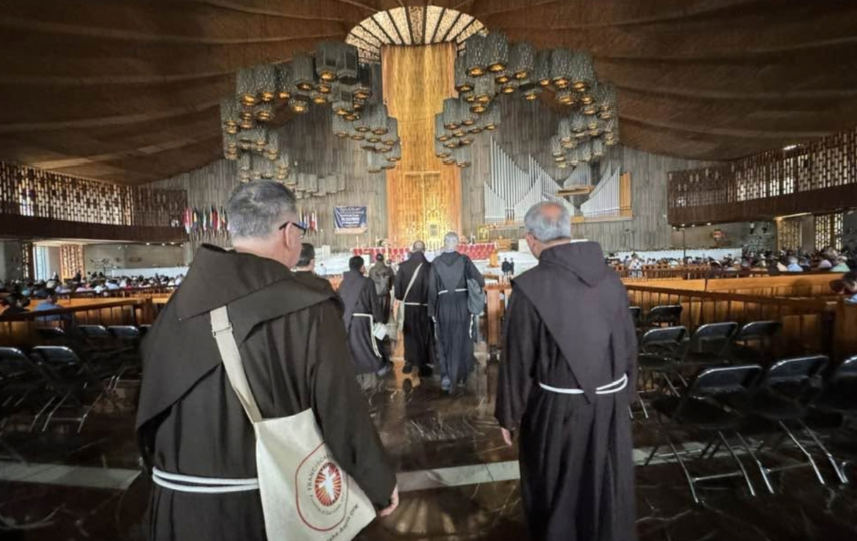 Franciscan friars approach the sanctuary inside the Basilica of Our Lady of Guadalupe in Mexico City during an earlier pilgrimage. The original tilma of St. Juan Diego bearing the image of Our Lady of Guadalupe is displayed above the main altar. (Photo by Br. Octavio Duran, OFM)
