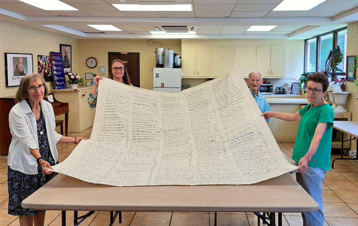 Parishioners of St. Camillus Church in Silver Spring, Maryland, stand in solidarity with thousands of young lives lost in Gaza by supporting the Children's Shroud. (Photo by Russ Testa)