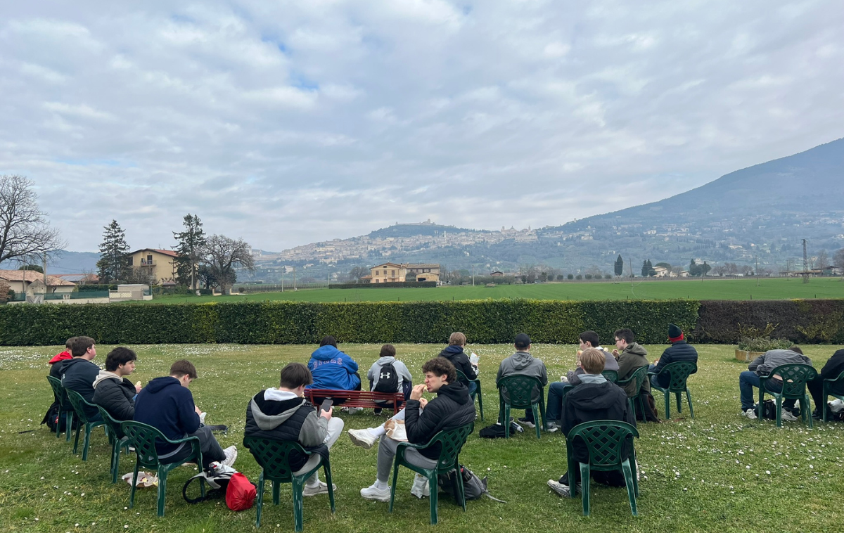 Students gather in Assisi Valley on pilgrimage. Br. John Cella, OFM, director of Franciscan Pilgrimage Programs, explained that these trips focus on Franciscan spirituality rather than general tourism or collecting souvenirs. (Photo by Sam Reinke, Franciscan Pilgrimages)