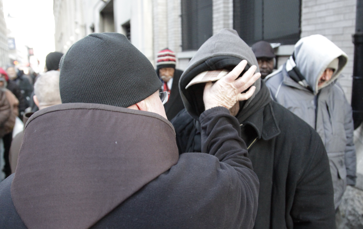 A friar offers ashes at the St. Francis Breadline in New York City. Ash Wednesday falls on Feb. 18 this year. (Photo by Br. Octavio Duran, OFM)